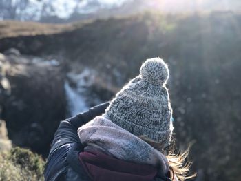 Rear view of woman wearing knit hat