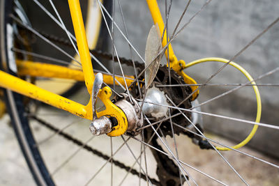 Close-up of yellow bicycle wheel