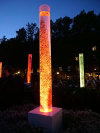 Illuminated built structure against sky at night