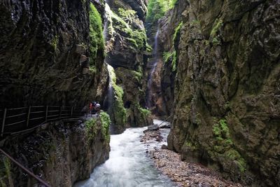 Scenic view of waterfall amidst rocks