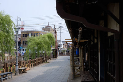 Street amidst buildings against sky