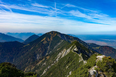 Scenic view of mountain range against blue sky