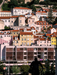 Rear view of townscape against houses in city