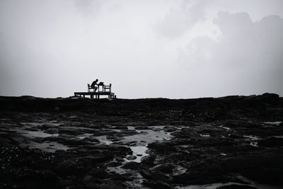 Man on beach against sky