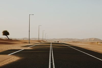 Empty road against clear sky