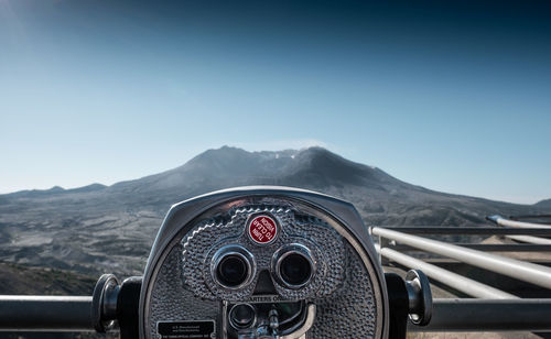 Close-up of coin-operated binoculars against clear sky