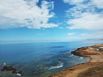 Scenic view of sea against cloudy sky