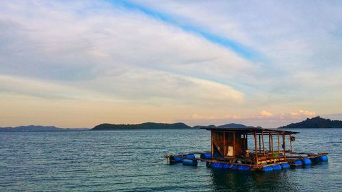 Scenic view of sea against sky at sunset