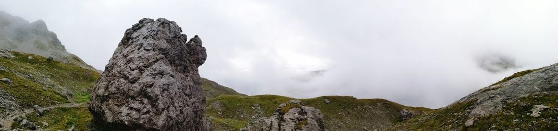 Low angle view of rocks against sky