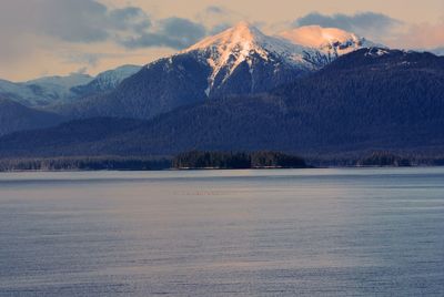 Scenic view of snowcapped mountains against sky during winter