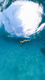 High angle view of man swimming in sea