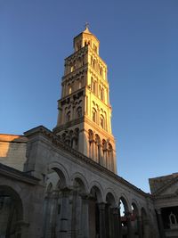 Low angle view of building against blue sky