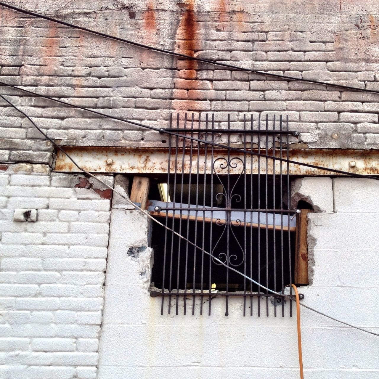 architecture, built structure, building exterior, brick wall, wall - building feature, old, weathered, damaged, abandoned, house, window, building, wall, stone wall, obsolete, low angle view, deterioration, run-down, brick, outdoors