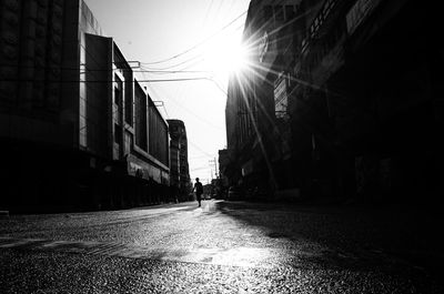 Street amidst buildings in city against sky