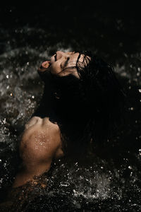 Portrait of woman relaxing in water