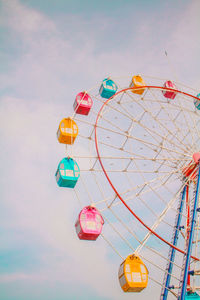 Low angle view of ferris wheel against sky