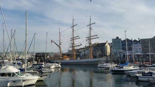 Boats moored at harbor