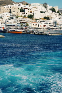 Scenic view of sea by houses