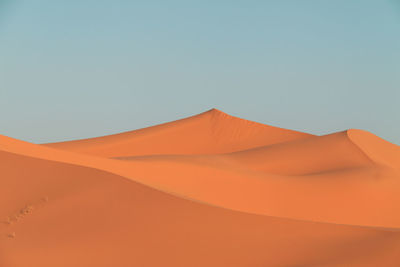 Scenic view of desert against clear sky