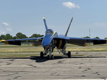 Low angle view of airplane flying against sky