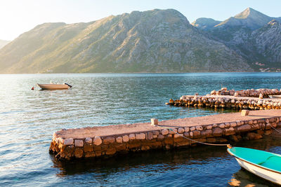 Scenery with harbor in the bay . pier for private boats . berth in kotor bay