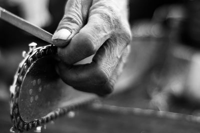 Close-up of hand in handsaw