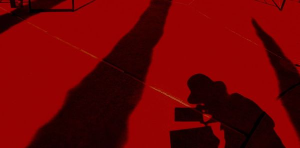Silhouette man standing in the dark