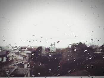 Close-up of hand against sky