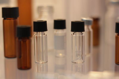 Close-up of empty medicine bottles on table