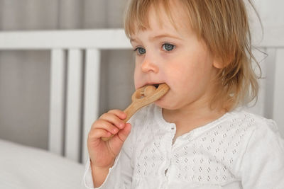 Close-up of boy eating food at home