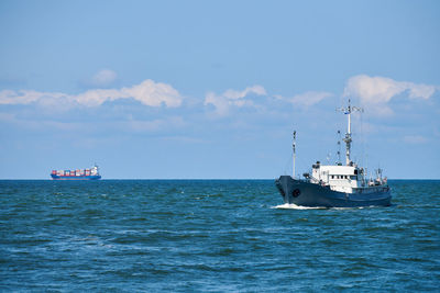 Survey vessel, research vessel patrol boat sailing in bright blue baltic sea, navy patrol vessel