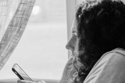 Portrait of woman using mobile phone