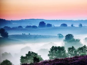 Scenic view of landscape against sky during sunset