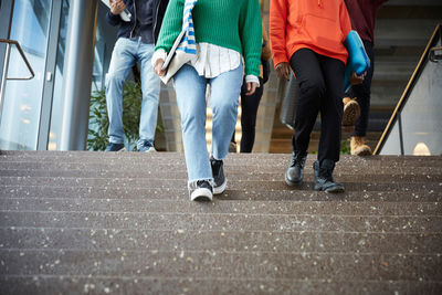 Low section of students moving down on steps at university