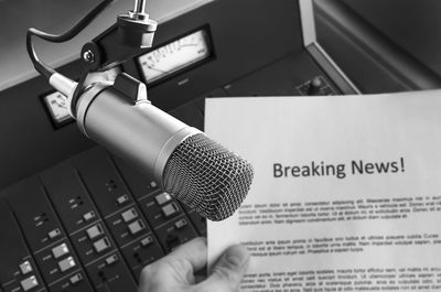 Close-up of hand holding microphone