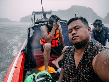 Portrait of people on boat in sea