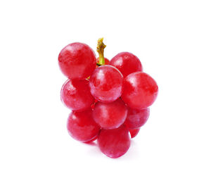 Close-up of grapes against white background