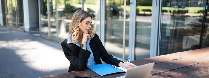 Businesswoman using mobile phone