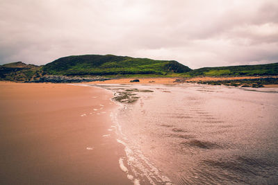 Scenic view of beach against sky