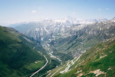 Aerial view of snowcapped mountains against sky