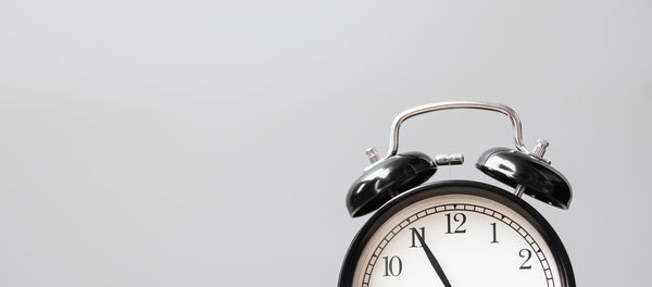 Close-up of clock against white background