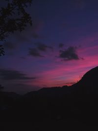 Scenic view of silhouette mountain against sky at sunset