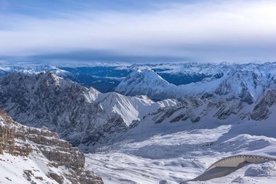 Scenic view of snowcapped mountains against sky