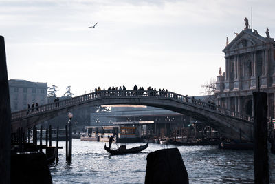 Bridge over river with city in background