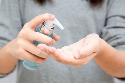 Midsection of couple holding hands