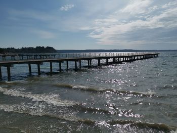 Pier over sea against sky