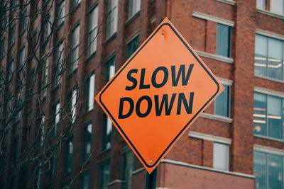 Close-up of arrow sign on road