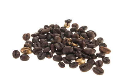 High angle view of coffee beans against white background