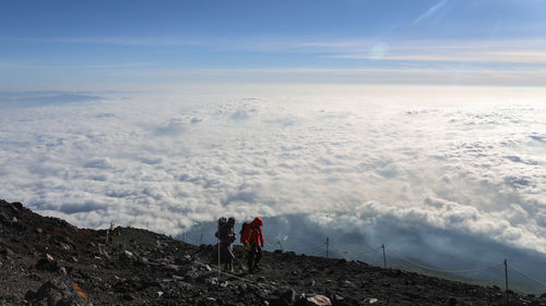 People on landscape against sky