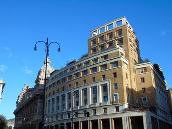 Low angle view of building against blue sky